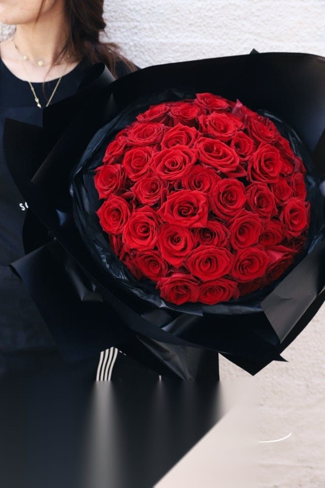 52 premium red roses in black