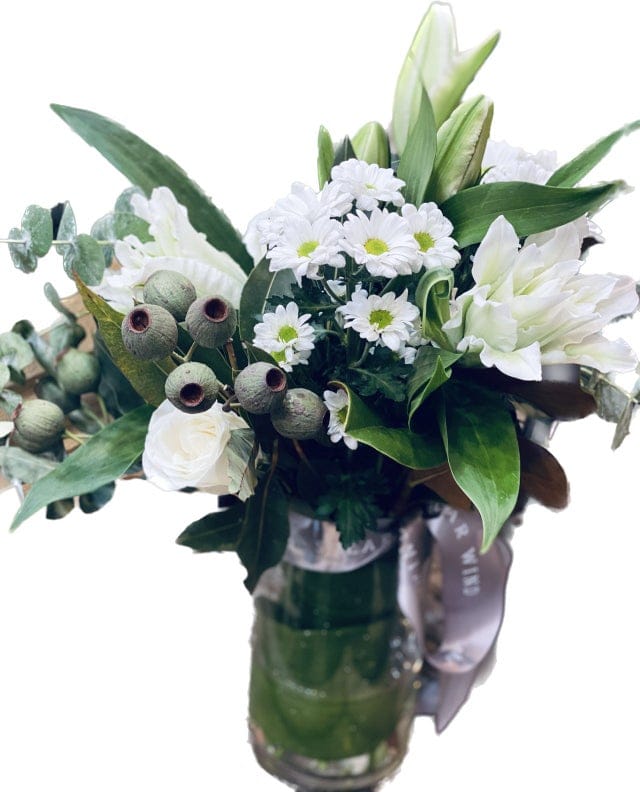 Oriental lily with daisy roses and gum nuts in vase